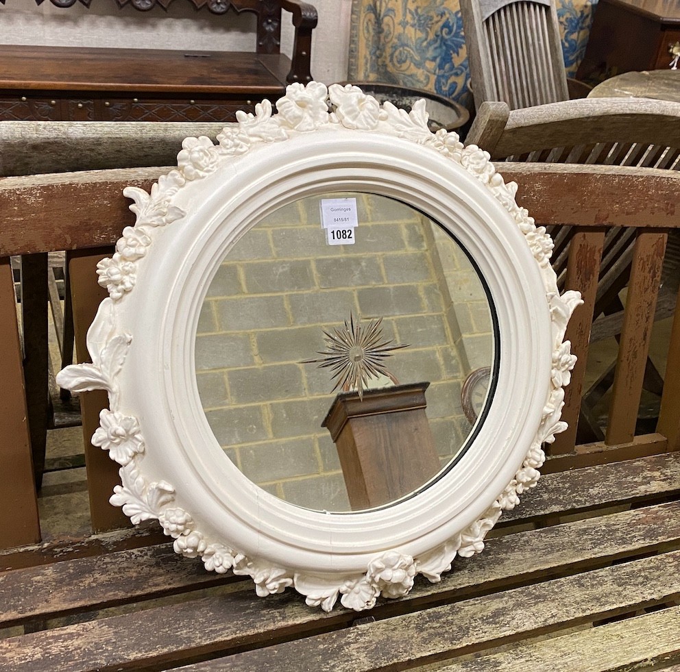 A circular white painted composition wall mirror with engraved plate, diameter 62cm